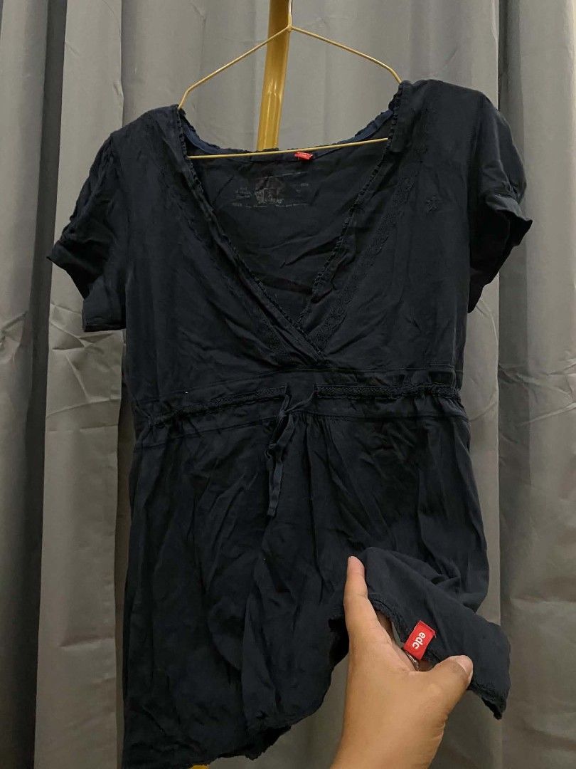 Edc by Esprit Navy Blue baby doll top Drawstring Waist (Category: Sleeveless) located in Malasiqui. Submitted by finnley26 (Listing ID 1463166315, Image 3). Description: - Navy blue wrap top - Brand: EDC by Esprit - Short sleeves - V-neckline - Drawstring waist for adjustable fit - Slightly crinkled fabric texture - Ideal for casual outings Small to med Note with small pin hole as in super small.