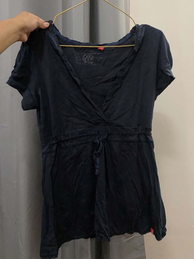 Edc by Esprit Navy Blue baby doll top Drawstring Waist (Category: Sleeveless) located in Malasiqui. Submitted by finnley26 (Listing ID 1463166315, Image 1). Description: - Navy blue wrap top - Brand: EDC by Esprit - Short sleeves - V-neckline - Drawstring waist for adjustable fit - Slightly crinkled fabric texture - Ideal for casual outings Small to med Note with small pin hole as in super small.