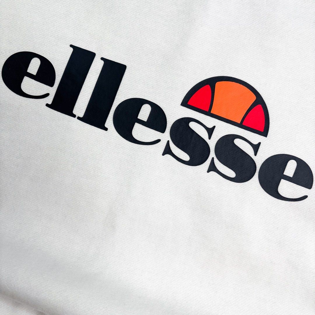 Ellesse | Sweater. (Category: Coats, Jackets and Outerwear) located in Manila. Submitted by bypiecesandstories (Listing ID 1463228516, Image 3). Description: Ellesse | Sweater. 849 PHP 🧡 Perfect Condition Can Fit — Small to Large Dimensions — W 23" L 27" A clean Ellesse sweater featuring a bold logo across the chest. Simple and classic, making it an easy piece to wear on its own or layer with your everyday fits. • REMINDERS • — Read the Rules & 