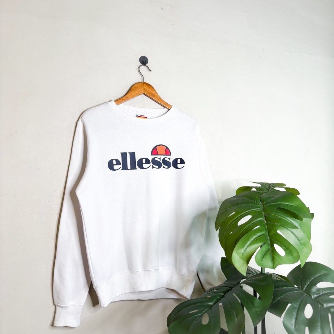 Ellesse | Sweater. (Category: Coats, Jackets and Outerwear) located in Manila. Submitted by bypiecesandstories (Listing ID 1463228516, Image 1). Description: Ellesse | Sweater. 849 PHP 🧡 Perfect Condition Can Fit — Small to Large Dimensions — W 23" L 27" A clean Ellesse sweater featuring a bold logo across the chest. Simple and classic, making it an easy piece to wear on its own or layer with your everyday fits. • REMINDERS • — Read the Rules & 
