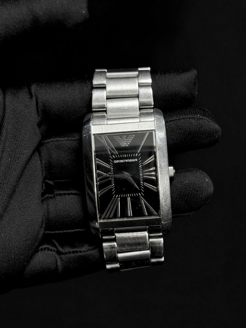 Emporio Armani Rectangular Black Dial Men's Watch (Category: Men's Watches) located in Caloocan City. Submitted by grandbear.ee4db0 (Listing ID 1463210073, Image 1). Description: EMPORIO ARMANI AR0156 ₱5,000 | Negotiable | Open for offers Specifications: • Collection: Classic • Movement: Quartz • Case: Stainless Steel, Rectangular • Case Size: Approx. 38 × 34 mm • Dial: Black with Roman Numerals • Features: Small Seconds Sub-Dial • Bracelet: Stai