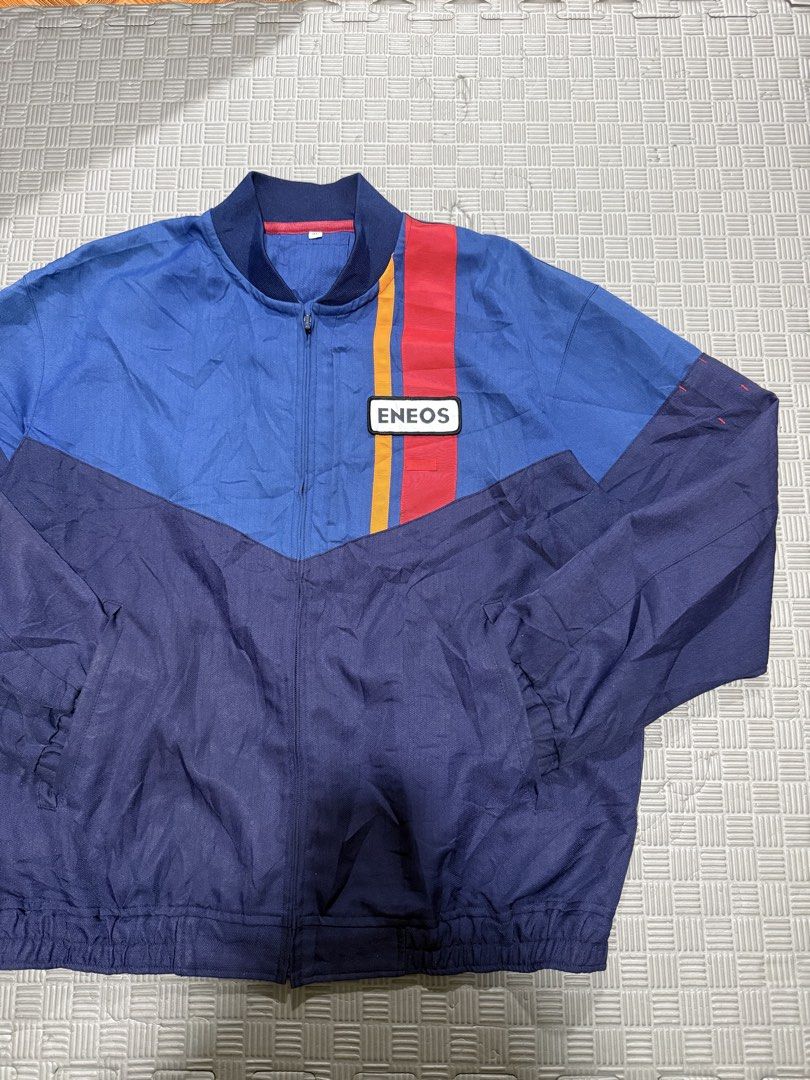 ENEOS Oi Gas Station Uniform (Category: Coats, Jackets and Outerwear) located in Baguio. Submitted by MysticVaultPh (Listing ID 1463292108, Image 2). Description: - Cool ENEOS jacket - Blue with red and yellow stripes - ENEOS logo patch on chest - Zip-up front - Elasticated cuffs and hem - Tiny pinhole on front (visible in last photo).