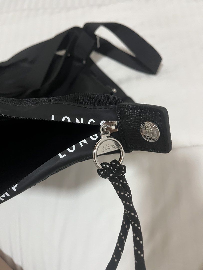 Energy Longchamp Black Nylon Backpack Tote Bag (Category: Backpacks) located in Caloocan City. Submitted by nobleflower_4c42cc (Listing ID 1463282148, Image 2). Description: - Authentic Black energy Longchamp Bag - Convertible: Wear as a backpack or a tote - Material: Durable nylon with genuine leather handles and trim - Closure: Secure zipper - Features: Longchamp logo printed on strap - Ideal for: Everyday use, travel, school, and more!.