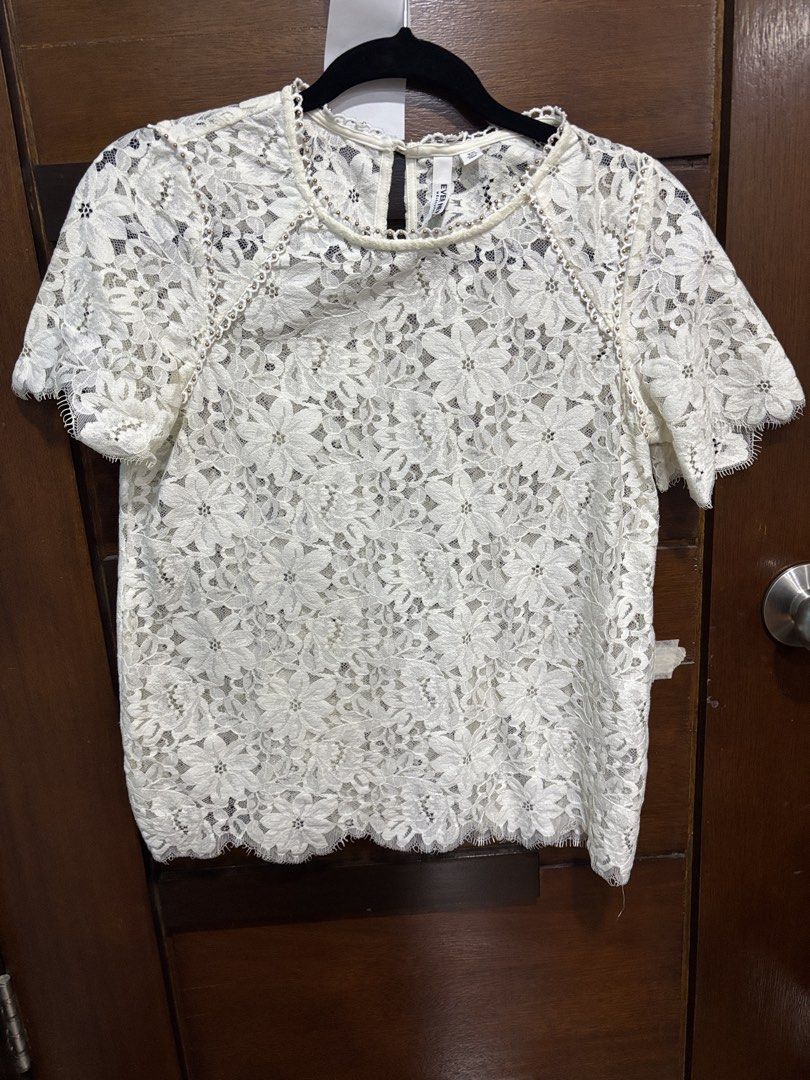 Ever New Melbourne White Lace Top XS (Category: Blouses) located in Mandaluyong City. Submitted by clothescarousel (Listing ID 1463250908, Image 1). Description: - Brand: Ever New Melbourne - Color: White - Style: Lace top - Sleeves: Short sleeves - Hem: Scalloped hem - Neckline: Delicate beaded detail - Closure: Keyhole closure at the back - Versatility: Perfect for dressing up or down, pairs well with jeans or skirts..