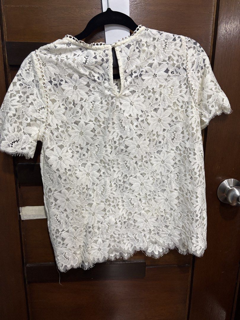 Ever New Melbourne White Lace Top XS (Category: Blouses) located in Mandaluyong City. Submitted by clothescarousel (Listing ID 1463250908, Image 3). Description: - Brand: Ever New Melbourne - Color: White - Style: Lace top - Sleeves: Short sleeves - Hem: Scalloped hem - Neckline: Delicate beaded detail - Closure: Keyhole closure at the back - Versatility: Perfect for dressing up or down, pairs well with jeans or skirts..