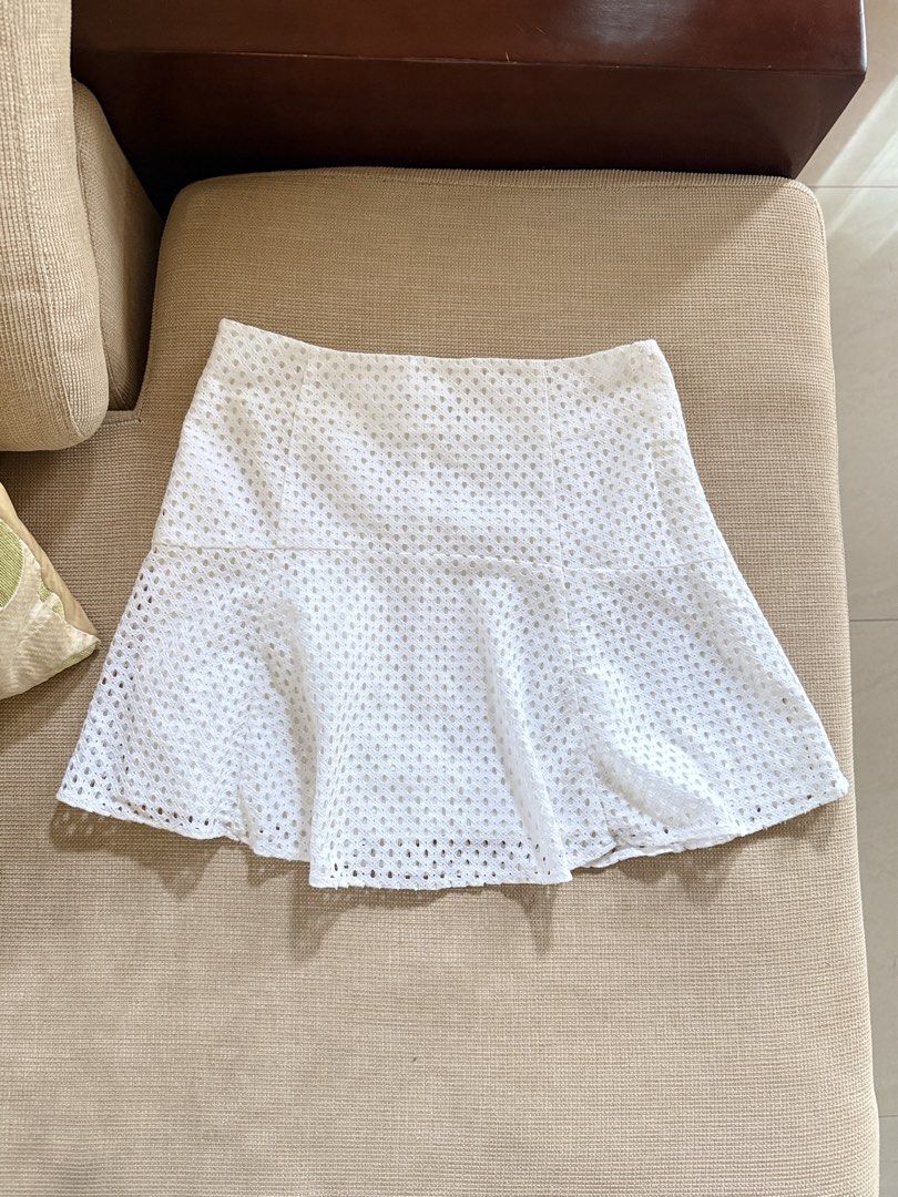 Eyelet skater/flared skirt (Category: Skirts) located in Valencia. Submitted by kimbeegals (Listing ID 1463143075, Image 2). Description: Selling super low. Bought from Korea last year. Korean brand. No flaws. Used only once for a photoshoot. Bought this for around 1k if converted to php. Super ganda ng fit. May silk inner lining. High quality fabric. 27-29 waistline. Medium. rfs: i have so many white skirts na .