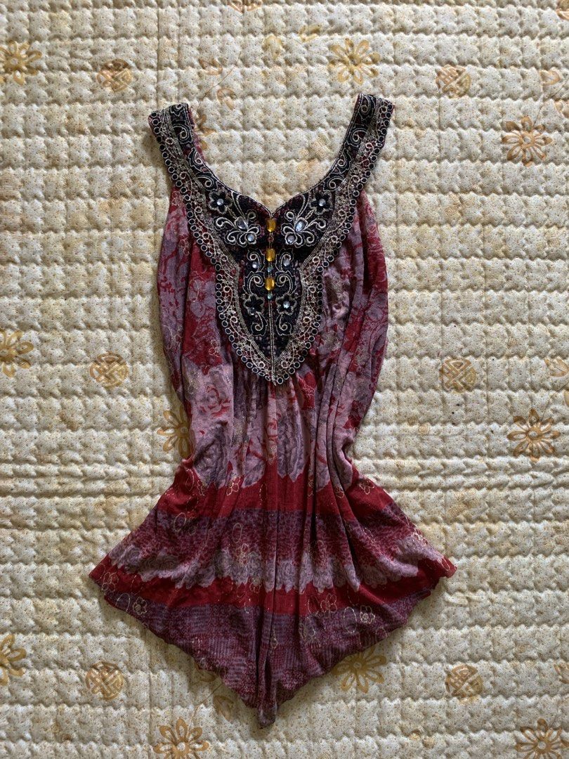 fairycore Embellished V-Neck Sleeveless Top (Category: Sleeveless) located in Sarangani. Submitted by solune_clo (Listing ID 1463238777, Image 1). Description: - Eye-catching red and purple pattern - Sleeveless design - Flattering V-neckline - Intricate black and gold embellishments - Delicate small yellow bead accents - Gently flared hem for a stylish silhouette - Perfect for dressing up or down.