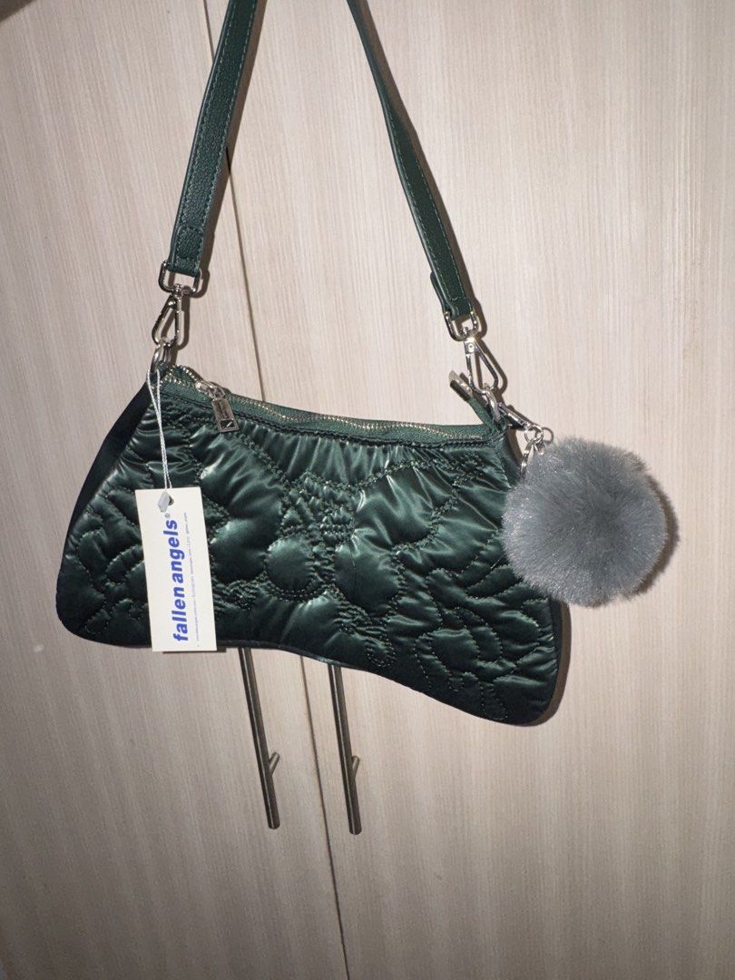 Fallen Angels Quilted Shoulder Bag with Pocket Charm (Category: Shoulder Bags) located in Taguig. Submitted by findfendifirst (Listing ID 1463239659, Image 1). Description: - Dark green quilted shoulder bag - Brand: Fallen Angels - Features a cute fluffy grey pom pom charm - Secure zipper closure - Adjustable strap for comfortable wear - Versatile for everyday use or a night out - Trendy and stylish design.