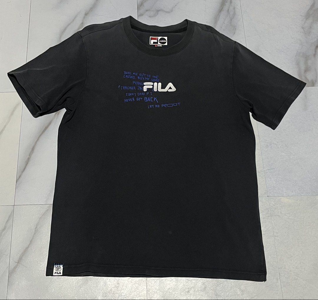 FILA Graphic T-Shirt (Category: Tshirts & Polo Shirts ) located in Cavite. Submitted by christianzuuu (Listing ID 1463134171, Image 1). Description: - Classic black Fila t-shirt - Eye-catching graphic prints on both front and back - Front features text and Fila logo - Back showcases multiple graphic elements and numbers - Short sleeves and comfortable crew neck - Ideal for casual everyday wear.