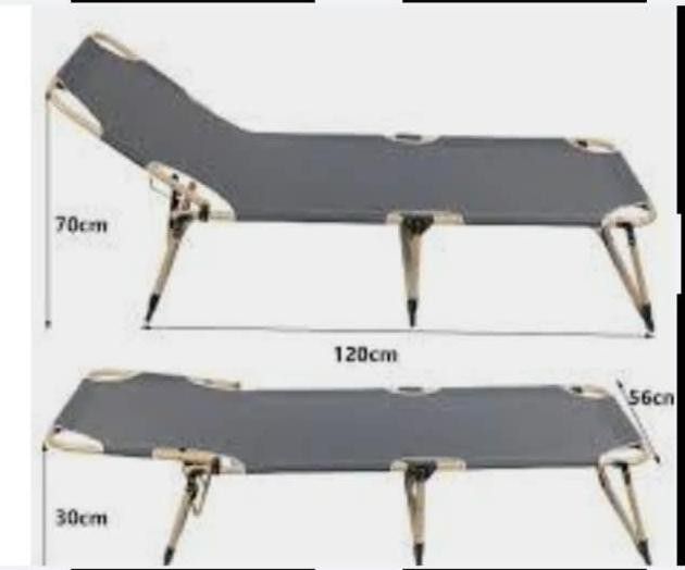 Foldable bed (Category: Bed Frames & Mattresses) located in Singapore. Submitted by 99global (Listing ID 1462084801, Image 2). Description: Type: Portable Folding single bed Use: Good for camping, emergency extra sleeping, or office lunch breaks. Design: Features a foldable metal frame and a durable fabric surface that rolls or folds up for easy storage Contact 88591822 for pick up or lalamove delivery.