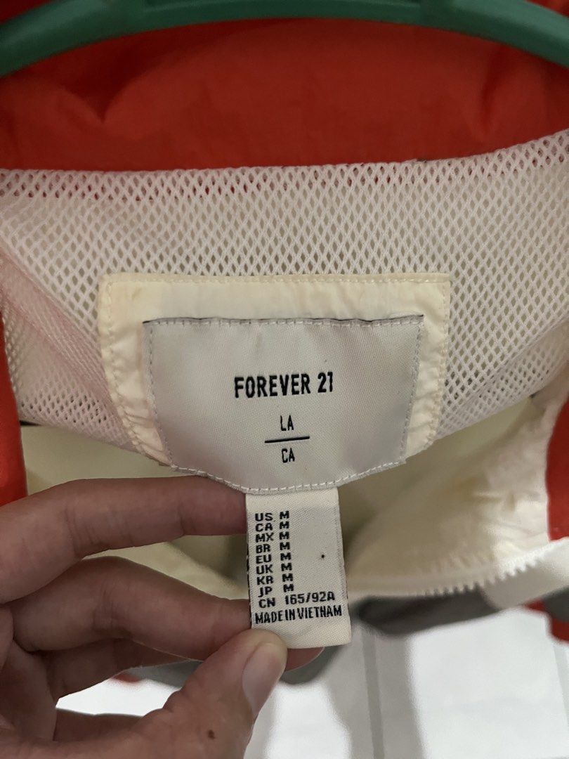 Forever 21 Colorblock Windbreaker Jacket (Category: Coats, Jackets and Outerwear) located in Mabalacat. Submitted by byjenica (Listing ID 1463238224, Image 2). Description: - Forever 21 Colorblock Windbreaker - Features white, grey, and red panels - Half-zip closure with a stand-up collar - Elasticated hem for a comfortable fit - Lightweight material, ideal for layering - Made in Vietnam.