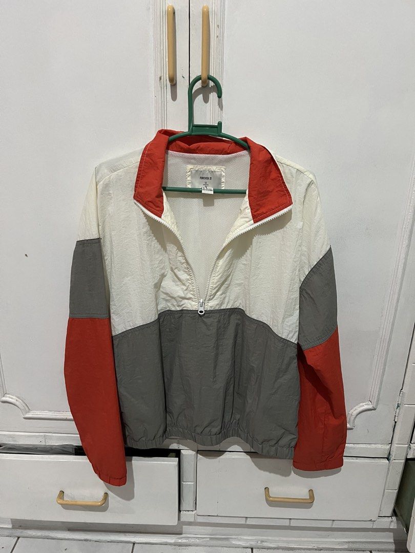 Forever 21 Colorblock Windbreaker Jacket (Category: Coats, Jackets and Outerwear) located in Mabalacat. Submitted by byjenica (Listing ID 1463238224, Image 1). Description: - Forever 21 Colorblock Windbreaker - Features white, grey, and red panels - Half-zip closure with a stand-up collar - Elasticated hem for a comfortable fit - Lightweight material, ideal for layering - Made in Vietnam.