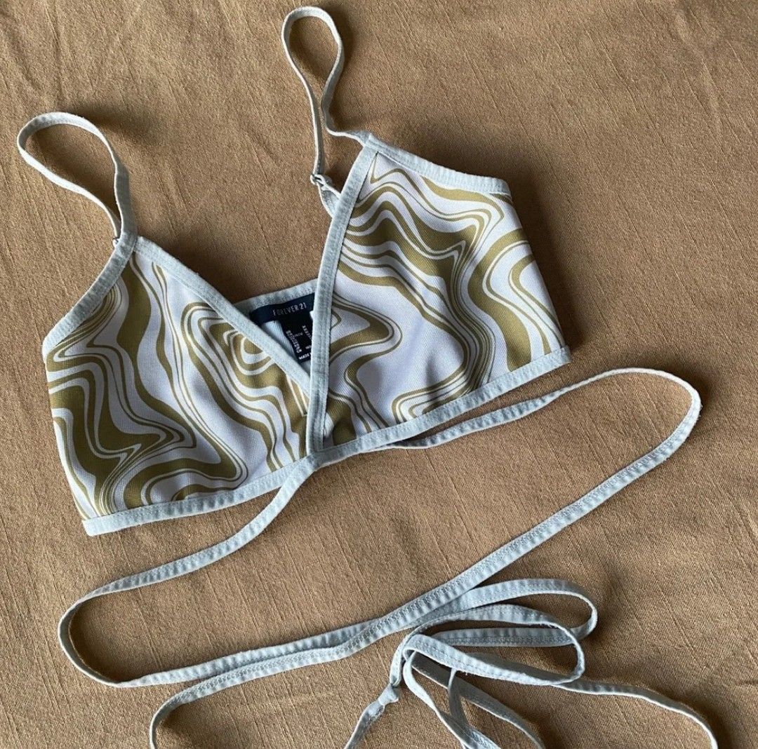 Forever 21 Swirl Print Wrap Crop Top (Category: Others Tops) located in Manila. Submitted by shajanina.14 (Listing ID 1463219802, Image 1). Description: Forever 21 Original Preloved As good as new Small- US As per measuring tape, Bust- 23 to 36 inches Length- 11 inches (adjustable straps) .