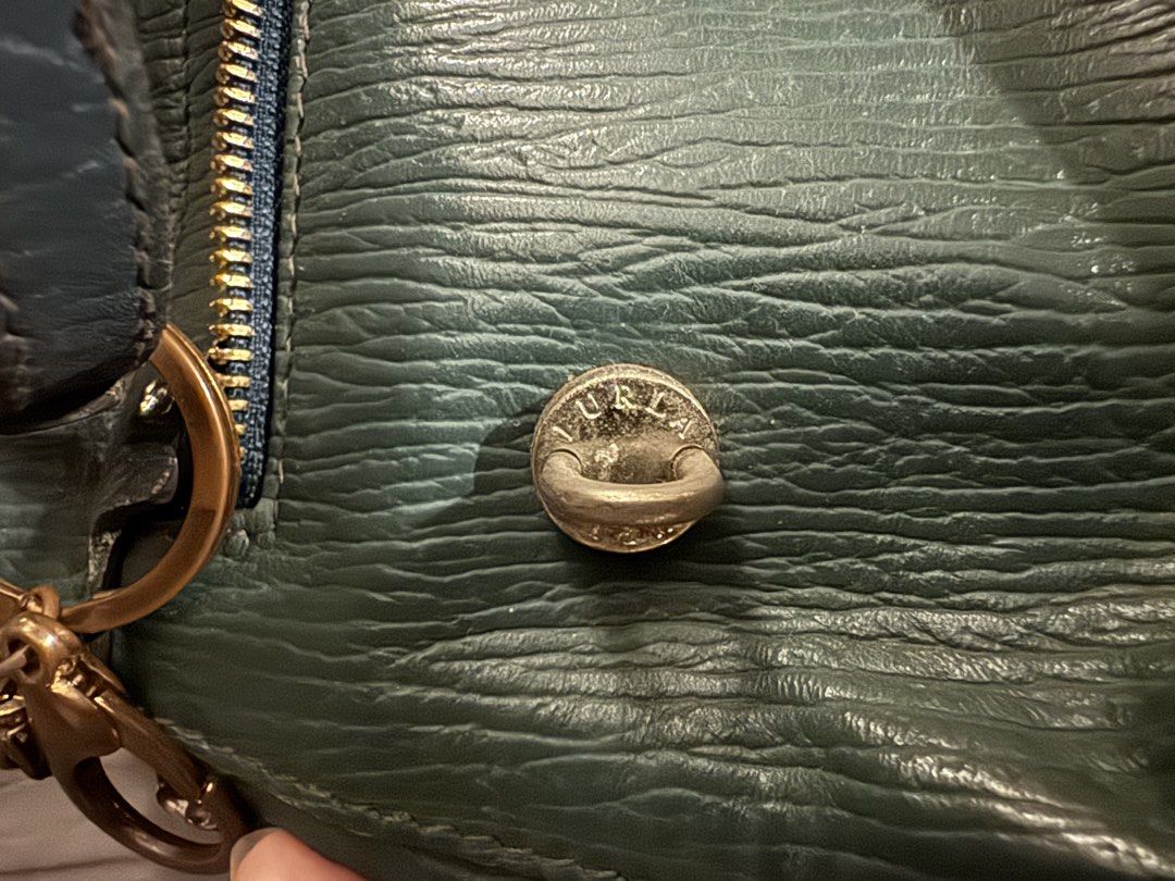 Furla Teal Small Satchel bag (Category: Luxury Bags & Wallets) located in Pasig City. Submitted by winnerva (Listing ID 1463262165, Image 3). Description: Small Vintage Furla satchel bag (comes with the strap) - Zip closure and top handles - Comes with a flower charm - Some wear on the bottom corners (please check photos for details) NEGOTIABLE and OPEN FOR TRADE RFS: not using anymore.