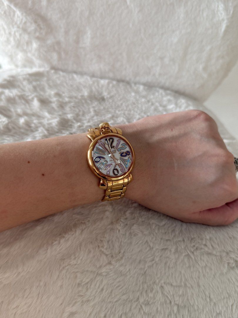 GaGa Milano Manuale 35 Watch (Category: Women's Watches) located in Quezon City. Submitted by closet24 (Listing ID 1463228085, Image 1). Description: - PinkGold tone watch -Stainless steel - Unique dial with colorful numbers - bracelet approx 15cm - Still in good condition -with box only (flawed leather interior).