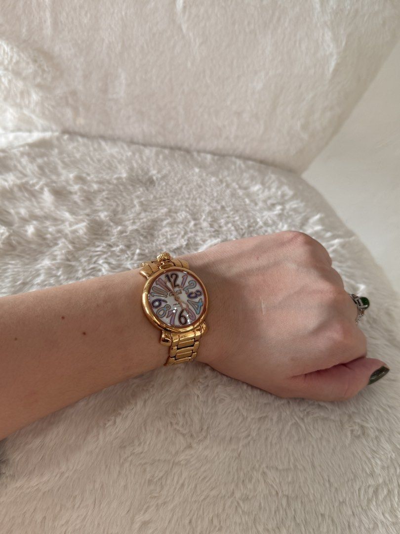 GaGa Milano Manuale 35 Watch (Category: Women's Watches) located in Quezon City. Submitted by closet24 (Listing ID 1463228085, Image 3). Description: - PinkGold tone watch -Stainless steel - Unique dial with colorful numbers - bracelet approx 15cm - Still in good condition -with box only (flawed leather interior).