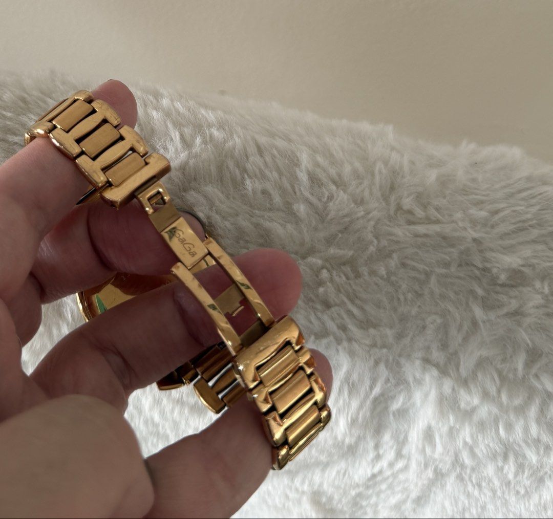 GaGa Milano Manuale 35 Watch (Category: Women's Watches) located in Quezon City. Submitted by closet24 (Listing ID 1463228085, Image 2). Description: - PinkGold tone watch -Stainless steel - Unique dial with colorful numbers - bracelet approx 15cm - Still in good condition -with box only (flawed leather interior).