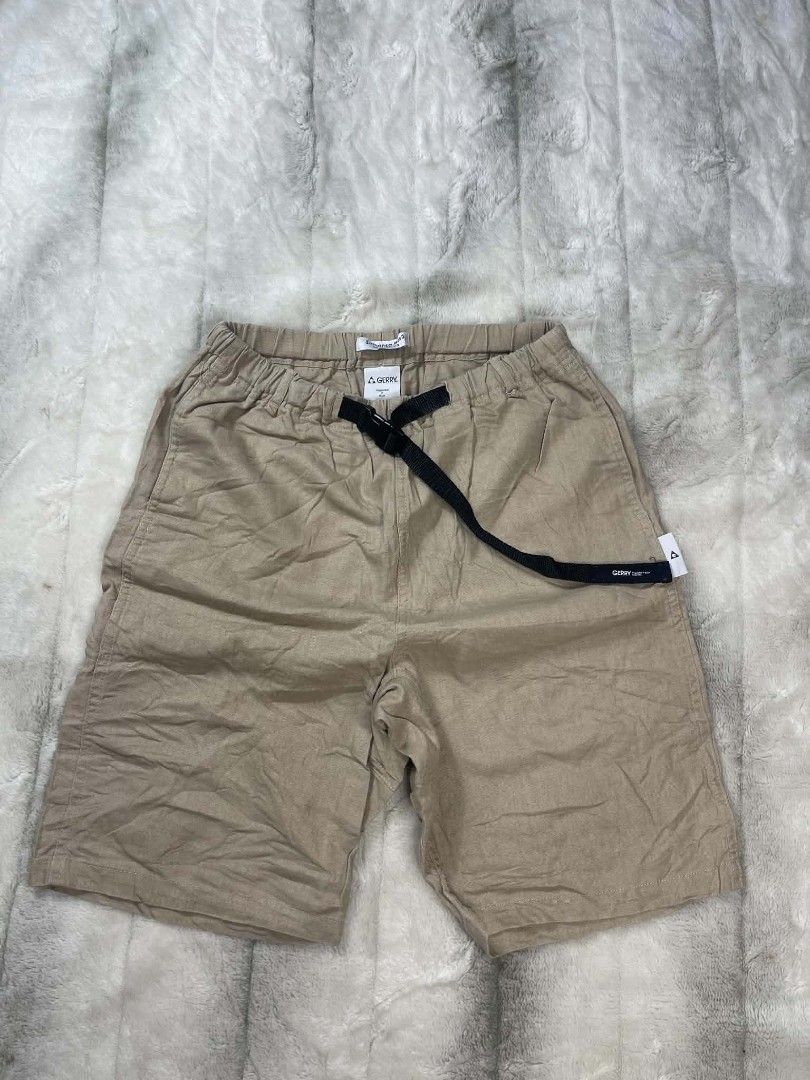 GERRY Beige Elastic Waist Drawstring Shorts (Category: Shorts) located in Manila. Submitted by ljbalza (Listing ID 1463149589, Image 1). Description: - Beige shorts from GERRY - Elastic waistband with black drawstring - Side tag detail - Comfortable for casual wear - Slightly crinkled fabric texture.