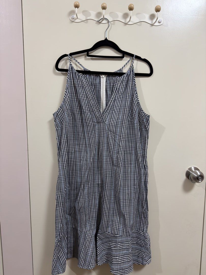Gingham Print V-Neck Mini Dress with Ruffle Hem (Category: Dresses) located in Manila. Submitted by lily.e0630 (Listing ID 1463289327, Image 1). Description: - Adorable gingham print dress - Bought in thailand - can fit small-medium - Flattering V-neckline - Delicate spaghetti straps - Convenient front zipper closure - Trendy ruffle hem detail - Ideal for casual outings and day trips.