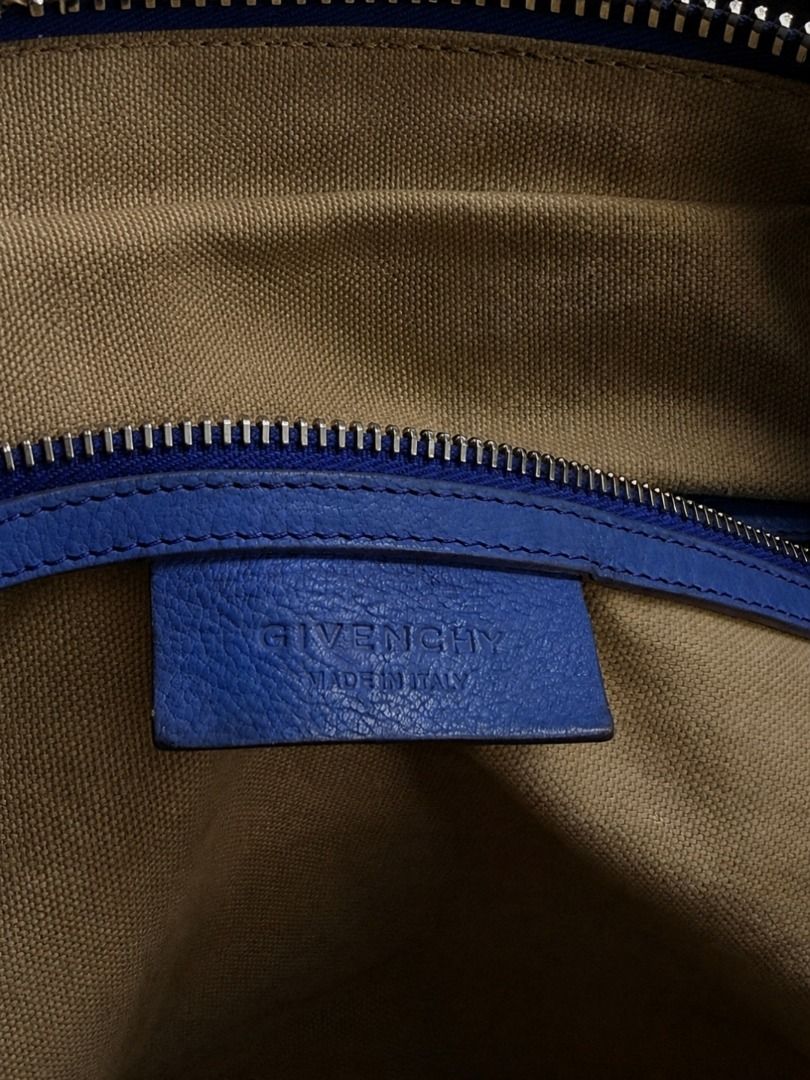 Givenchy Blue Leather Nightingale Bag (Category: Luxury Bags & Wallets) located in Caloocan City. Submitted by grandbear.ee4db0 (Listing ID 1463203066, Image 3). Description: GIVENCHY NIGHTINGALE BAG ₱15,000 | Negotiable Specifications: • Brand: Givenchy • Model: Nightingale • Color: Blue • Material: Leather • Hardware: Gold-tone Givenchy 4G Logo Hardware • Style: Large Top-Handle / Shoulder Tote • Design: Signature Nightingale double handles wit