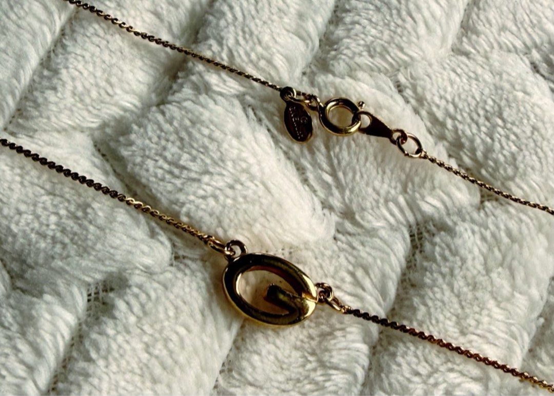 Givenchy Necklace (Category: Necklaces) located in Quezon City. Submitted by liezl.marie (Listing ID 1463160143, Image 3). Description: A vintage Giv€nchy gold-tone oval “G” pendant necklace featuring a delicate twist chain. 3,200 Open for layaway. Disclaimer: We are not affiliated, associated, authorized, endorsed by or in any way officially connected with any other company or luxury brand. All copyrights are reserved to the original brand..