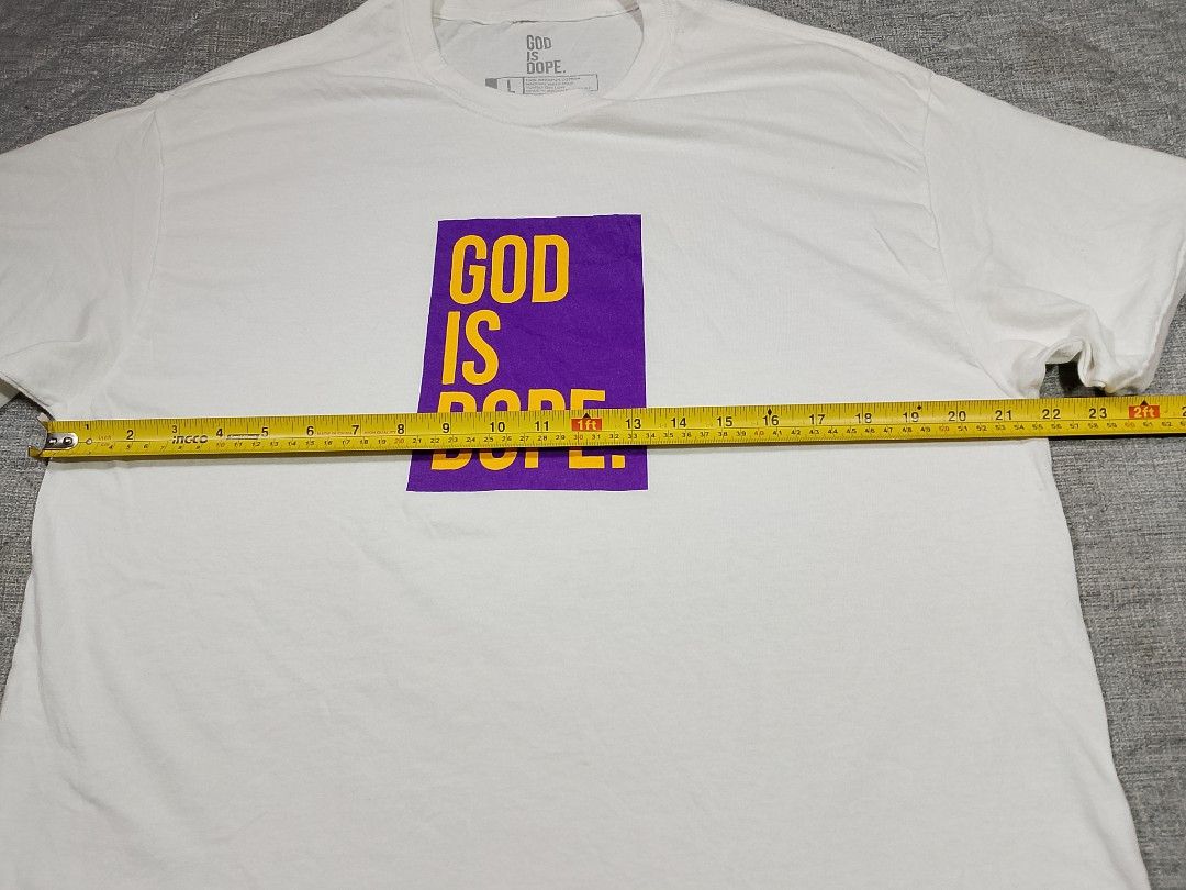 GOD IS DOPE white graphic T-shirt (Category: Tshirts & Polo Shirts ) located in Cadiz. Submitted by comradstuff (Listing ID 1463126872, Image 2). Description: GOD IS DOPE white graphic T-shirt w 22" l 31".