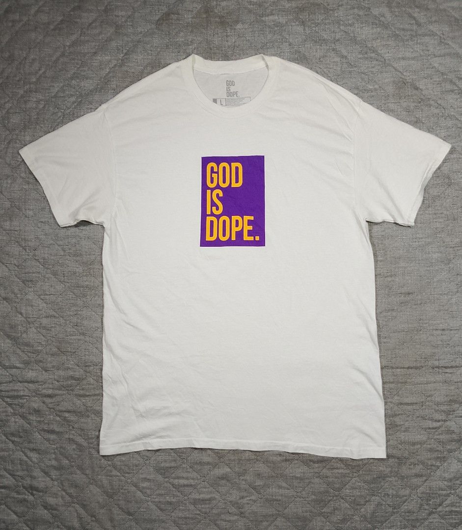 GOD IS DOPE white graphic T-shirt (Category: Tshirts & Polo Shirts ) located in Cadiz. Submitted by comradstuff (Listing ID 1463126872, Image 1). Description: GOD IS DOPE white graphic T-shirt w 22" l 31".