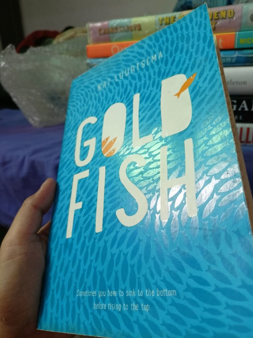 Gold Fish by Nat Luurtsema Paperback Book (Category: Storybooks) located in Tumauini. Submitted by qeynichi (Listing ID 1463325863, Image 3). Description: - Title: Gold Fish - Author: Nat Luurtsema - Format: Paperback - Cover: Blue with white text and orange goldfish illustrations - Condition: Pages show some yellowing on the edges - Genre: Great read for anyone who enjoys a good story.
