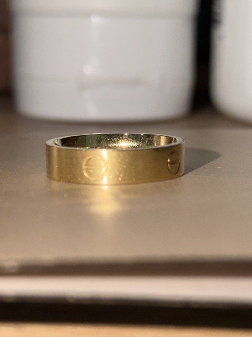 Gold Ring with Screw Detail (Category: Rings) located in Pasig City. Submitted by hshmt (Listing ID 1463126204, Image 2). Description: - Classic gold band ring - Features iconic screw motif - Simple and timeless design - Ideal for stacking or wearing alone - Shows minor signs of wear (please check photos for details) - 18k 2.4grams size 7 comfort fit.