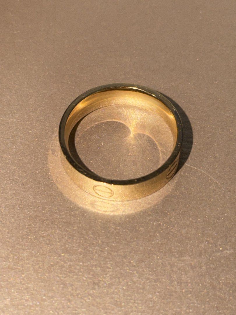 Gold Ring with Screw Detail (Category: Rings) located in Pasig City. Submitted by hshmt (Listing ID 1463126204, Image 3). Description: - Classic gold band ring - Features iconic screw motif - Simple and timeless design - Ideal for stacking or wearing alone - Shows minor signs of wear (please check photos for details) - 18k 2.4grams size 7 comfort fit.