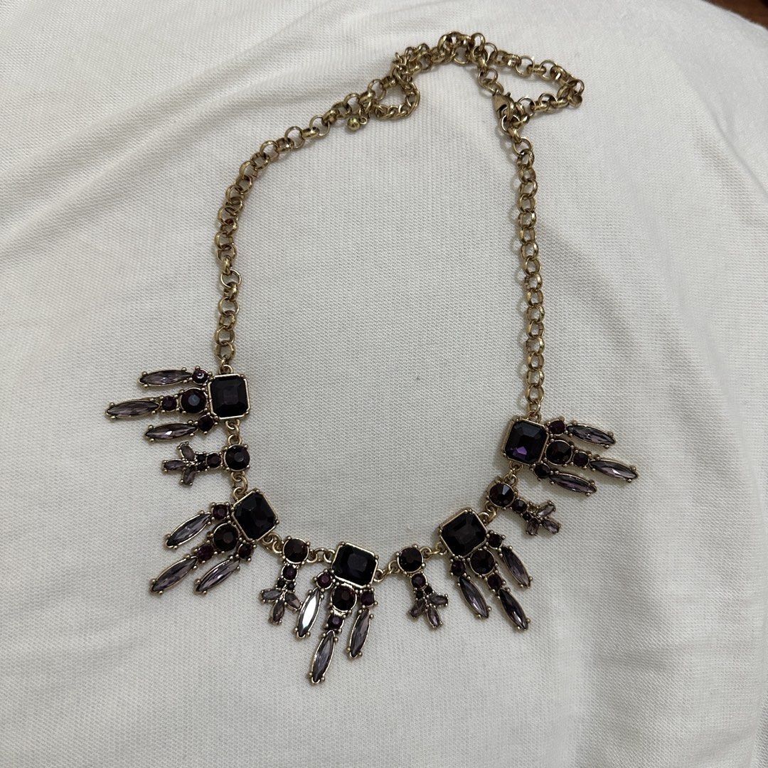 Gold Tone Statement Necklace Bundle (Category: Necklaces) located in Bulacan. Submitted by enne_123 (Listing ID 1463238740, Image 2). Description: - Gold-tone necklace with a striking statement pendant. - Features dazzling square and baguette-cut gems in rich blue and purple. - Classic link chain design. - Adds a vibrant pop of color and sparkle to any ensemble. - Versatile piece, ideal for elevating casual outfits or complementing evening wear..