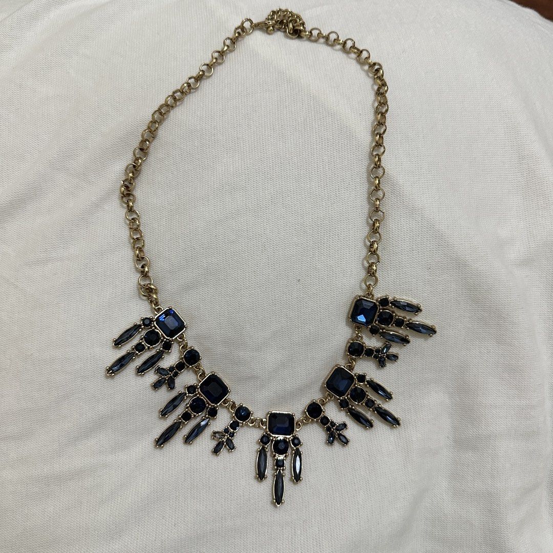 Gold Tone Statement Necklace Bundle (Category: Necklaces) located in Bulacan. Submitted by enne_123 (Listing ID 1463238740, Image 1). Description: - Gold-tone necklace with a striking statement pendant. - Features dazzling square and baguette-cut gems in rich blue and purple. - Classic link chain design. - Adds a vibrant pop of color and sparkle to any ensemble. - Versatile piece, ideal for elevating casual outfits or complementing evening wear..