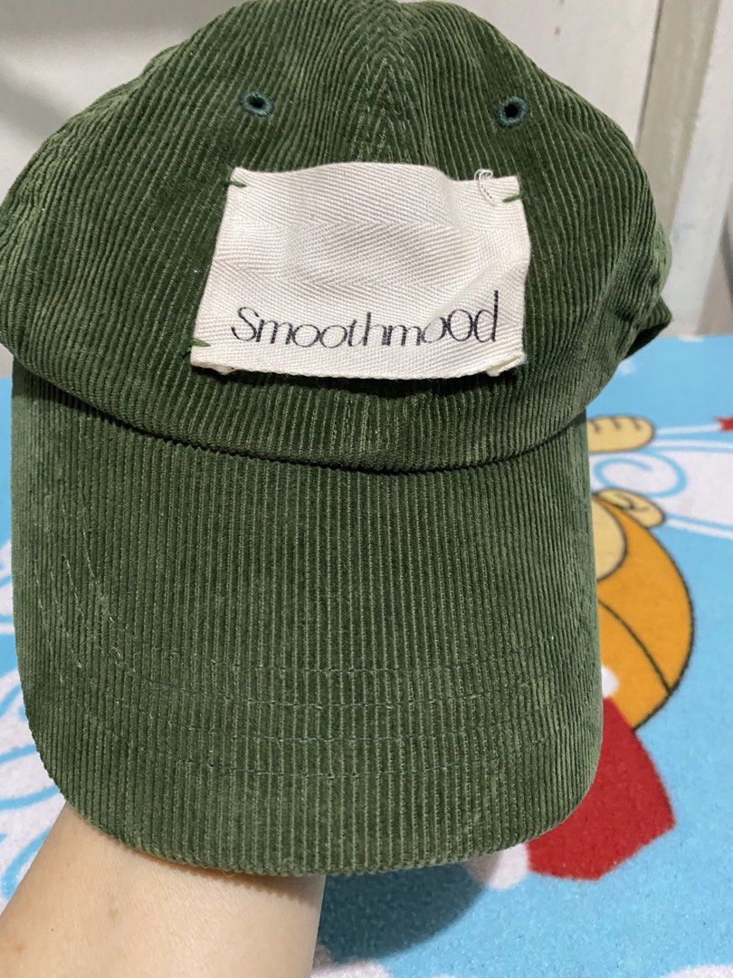 Green Corduroy Cap with Smoothmood Patch (Category: Caps & Hats) located in Manila. Submitted by resi.diaz (Listing ID 1463277554, Image 2). Description: - Trendy green corduroy baseball cap - Features a white patch with 'Smoothmood' text - Adjustable strap at the back for a custom fit - Ideal for everyday casual wear.