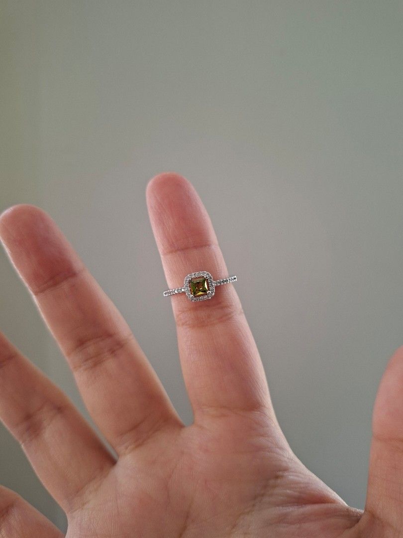 Green Peridot Silver Adjustable Ring (Category: Rings) located in Dasmarinas. Submitted by danabrie22 (Listing ID 1463216943, Image 2). Description: adjustable size 5 - 9 very well-made, excellent crafstmanship 10/10 condition brand new stainless steel & colored cubic zirconia stones made in Hongkong.