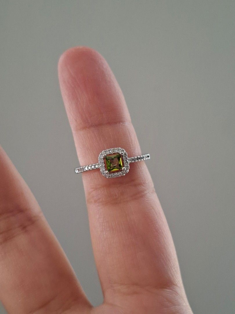 Green Peridot Silver Adjustable Ring (Category: Rings) located in Dasmarinas. Submitted by danabrie22 (Listing ID 1463216943, Image 1). Description: adjustable size 5 - 9 very well-made, excellent crafstmanship 10/10 condition brand new stainless steel & colored cubic zirconia stones made in Hongkong.