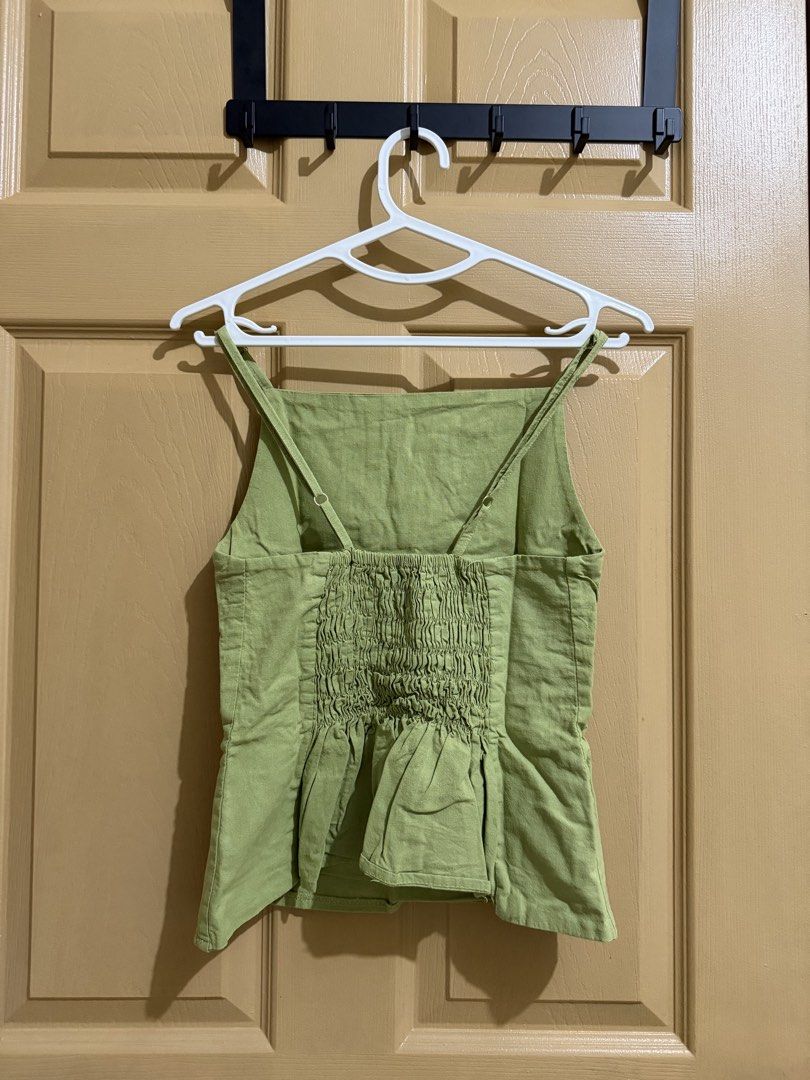 Green Smocked Back Square Neck Tank Top (Category: Sleeveless) located in Manila. Submitted by chavirly (Listing ID 1463268065, Image 2). Description: - Adorable green tank top - Chic square neckline - Adjustable straps for a custom fit - Smocked back for a snug and flattering silhouette - Stylish peplum hem detail - Versatile for casual outings or dressing up.