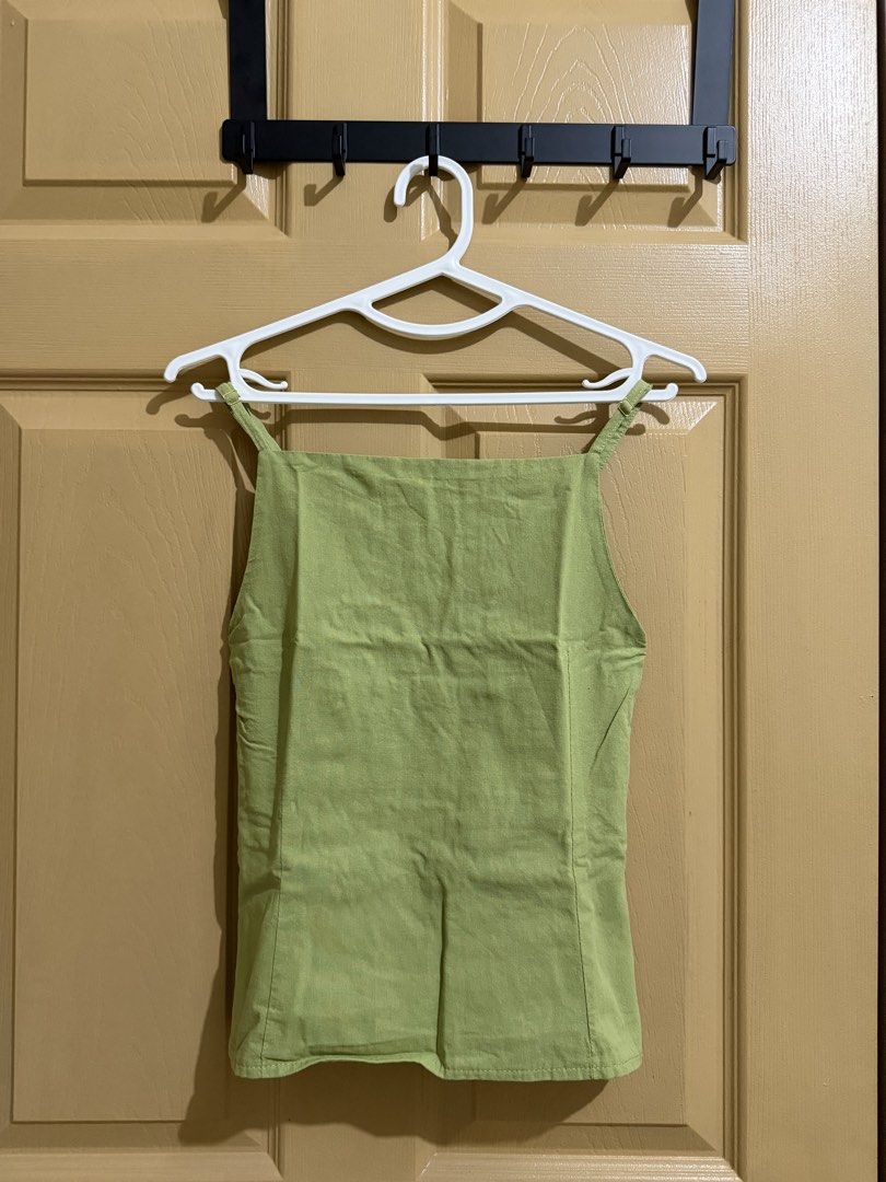 Green Smocked Back Square Neck Tank Top (Category: Sleeveless) located in Manila. Submitted by chavirly (Listing ID 1463268065, Image 1). Description: - Adorable green tank top - Chic square neckline - Adjustable straps for a custom fit - Smocked back for a snug and flattering silhouette - Stylish peplum hem detail - Versatile for casual outings or dressing up.