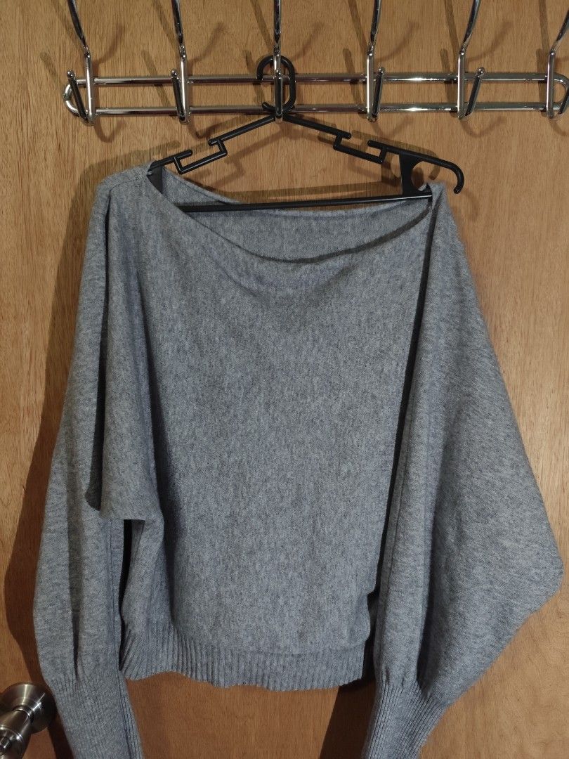 Grey Dolman Sleeve Sweater (Category: Coats, Jackets and Outerwear) located in Manila. Submitted by wisegem-c6c7 (Listing ID 1463185946, Image 1). Description: - Comfy grey sweater - Features dolman sleeves - Wide neckline for a relaxed fit - Ribbed cuffs and hem - Made from soft material - Ideal for casual outfits or layering.