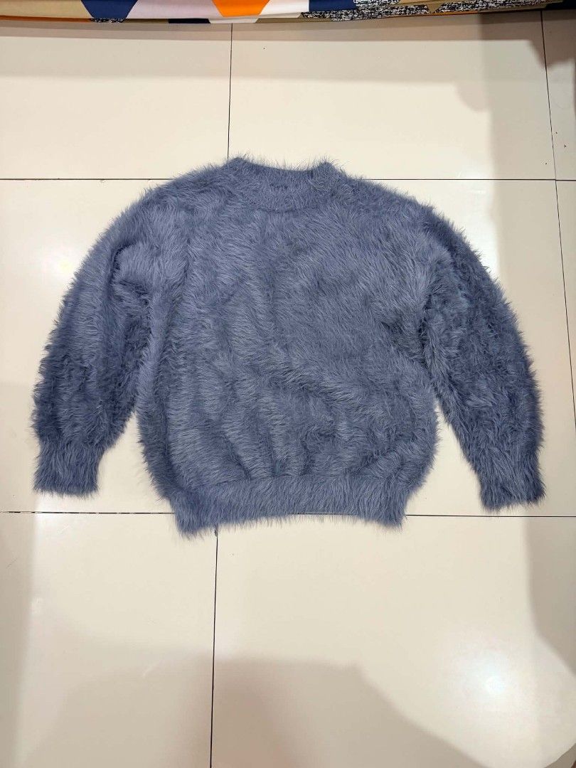 Grey Fuzzy Mock Neck Sweater (Category: Coats, Jackets and Outerwear) located in Manila. Submitted by thrift.glaizee (Listing ID 1463295971, Image 1). Description: - Super soft and fuzzy grey sweater - Mock neck style - Long sleeves with ribbed cuffs - Feels warm and cozy - Ideal for cooler weather - Versatile: pairs well with jeans or skirts.