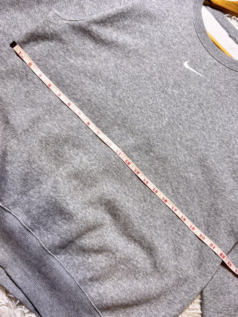 Grey Nike Crewneck Sweatshirt (Category: Coats, Jackets and Outerwear) located in Catbalogan. Submitted by christopszxc31 (Listing ID 1463279335, Image 3). Description: - Classic grey Nike sweatshirt - Simple swoosh logo on the chest - Crewneck style - 22x27 Large to XLarge - Ribbed cuffs and hem - Comfortable, everyday piece - Measurements shown in photos - Great for casual wear.