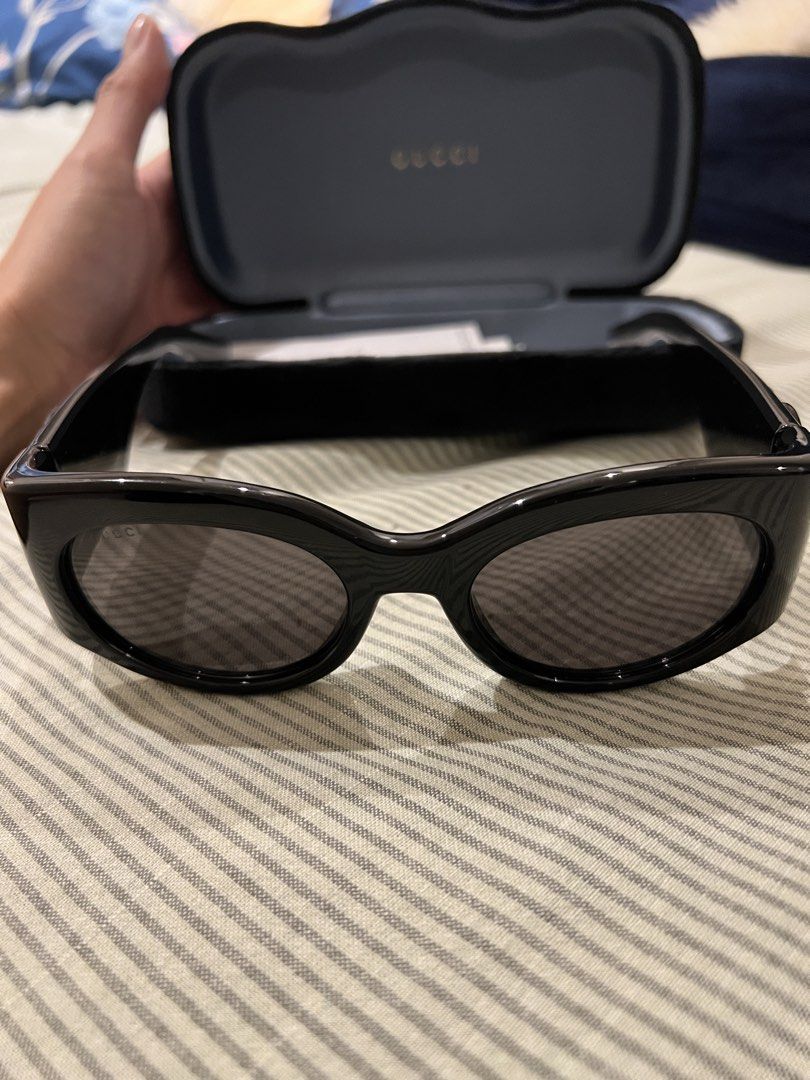 Gucci Black Cat Eye Sunglasses with Case (Category: Sunglasses & Eyewear) located in Marikina City. Submitted by patrickmontojo.ramos (Listing ID 1463276405, Image 2). Description: - Authentic Gucci sunglasses - Stylish black cat-eye frames - Iconic GG logo detail on the sides - Expertly crafted in Italy - Comes with original Gucci case - Ideal for sunny days and adding flair to your look.