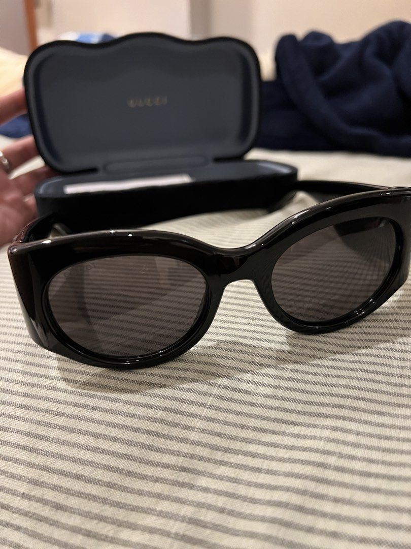 Gucci Black Cat Eye Sunglasses with Case (Category: Sunglasses & Eyewear) located in Marikina City. Submitted by patrickmontojo.ramos (Listing ID 1463276405, Image 3). Description: - Authentic Gucci sunglasses - Stylish black cat-eye frames - Iconic GG logo detail on the sides - Expertly crafted in Italy - Comes with original Gucci case - Ideal for sunny days and adding flair to your look.