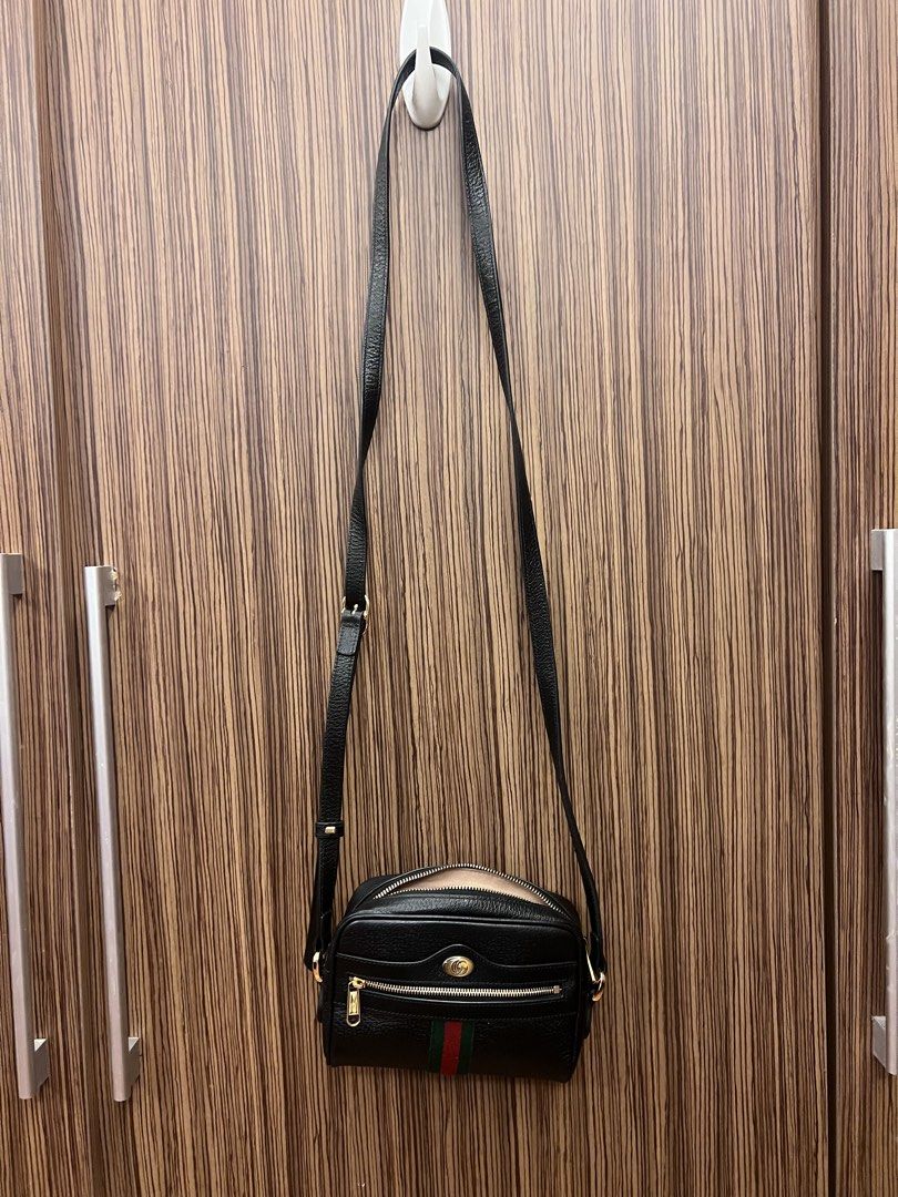 Gucci Black Leather Ophidia Camera Bag (Category: Luxury Bags & Wallets) located in Paranaque City. Submitted by katlopez0214 (Listing ID 1463238055, Image 2). Description: - Authentic Black Leather Gucci Camera Bag - Gold Hardware - Signature Green and Red Stripe - Secure Zip Closure - Interior Pocket - Convenient Keychain Clip - Adjustable Strap for Comfort - Ideal for Everyday Use.