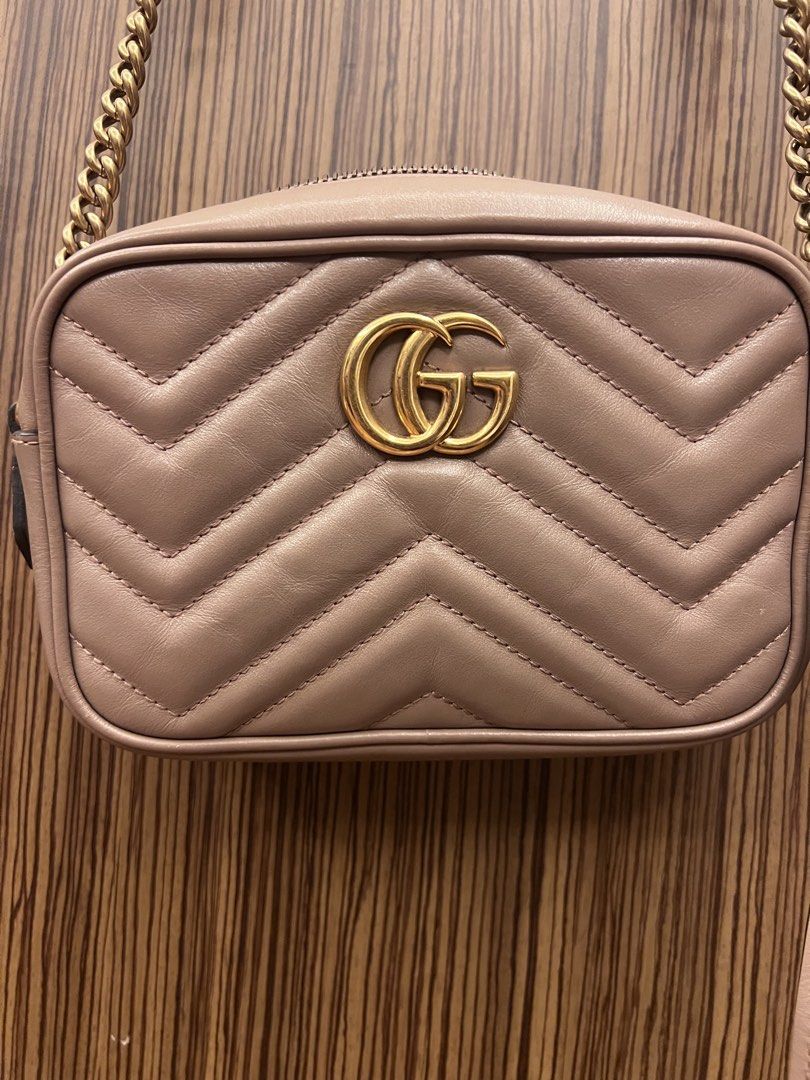 Gucci Marmont Camera Bag Beige Leather (Category: Luxury Bags & Wallets) located in Paranaque City. Submitted by katlopez0214 (Listing ID 1463233223, Image 1). Description: - Authentic Gucci Marmont camera bag - Color: Beige quilted leather - Hardware: Gold GG logo - Straps: Detachable chain strap and leather shoulder strap - Closure: Zipper - Condition: Excellent - with generic dustbag.
