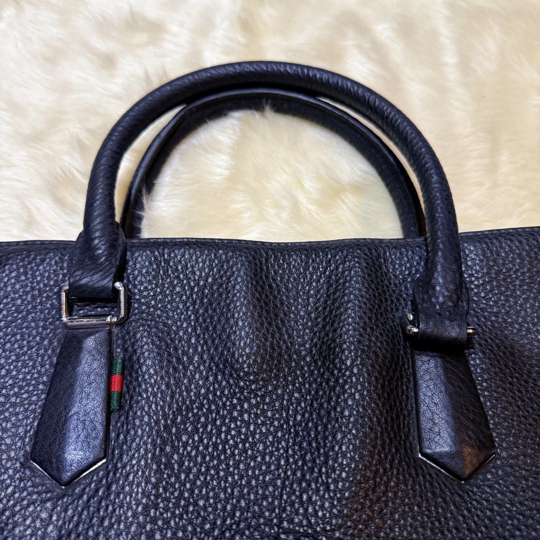 Gucci Pebbled Leather Briefcase / Business Tote (Category: Laptop Bags & Sleeves) located in Cainta. Submitted by shangitta (Listing ID 1463156752, Image 2). Description: Declutterring my work bags / laptop bags. Overall in very good pre-loved condition. The pebbled leather remains clean, supple, and well-structured. There are minor storage press marks on the front from the handles resting against the leather, which is common with soft pebbled le