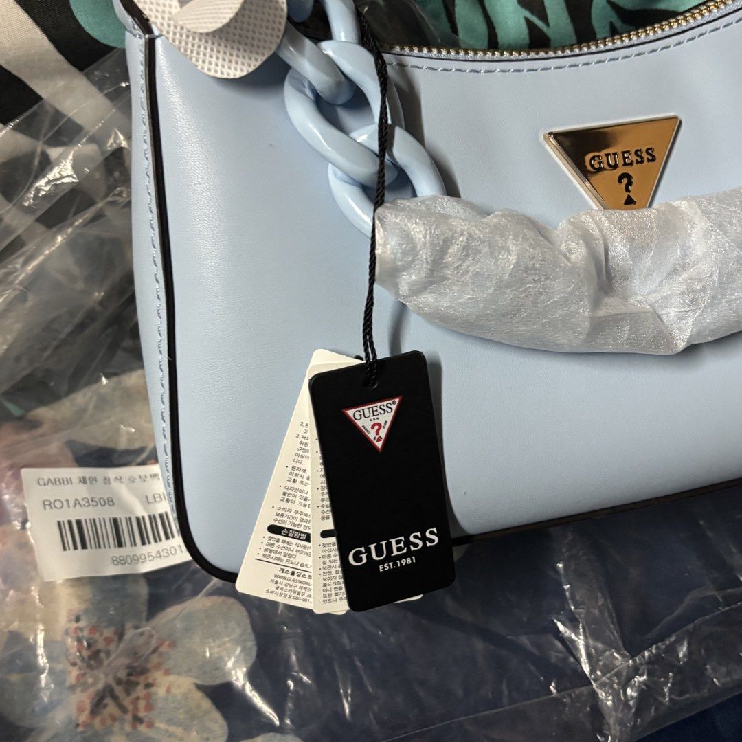 Guess Gabbi Shoulder Bag Light Blue (Category: Shoulder Bags) located in Manila. Submitted by archivebaek (Listing ID 1463280752, Image 3). Description: - Brand new Guess Gabbi Hobo Shoulder Bag in Light Blue - Features a stylish chunky chain strap - Comes with original tags and packaging (plastic only) - Purchased directly from South Korea - Original price: around ₱4000 - Selling price: ₱2950 MOP: Gcash, Maribank, Gotyme MOD : Lalamove or J&T (S
