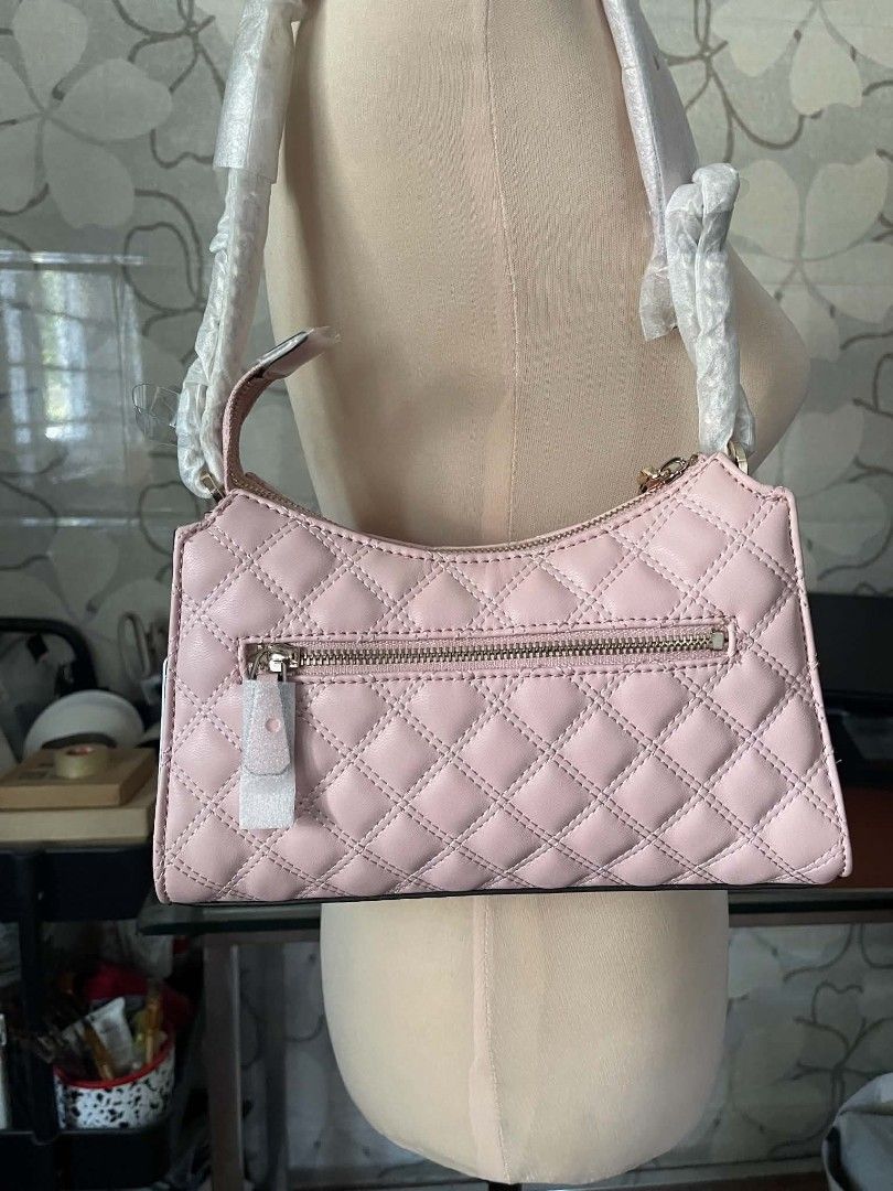 Guess Gully Quilted Shoulder Bag in Peony (Category: Shoulder Bags) located in Manila. Submitted by najiecart (Listing ID 1463325554, Image 3). Description: - Brand new pink Guess shoulder bag - Elegant quilted design - Chic gold hardware - Secure zipper closure - Interior Guess logo lining - Convenient interior zip pocket - Comes with original dust bag - Strap still has protective plastic on it.