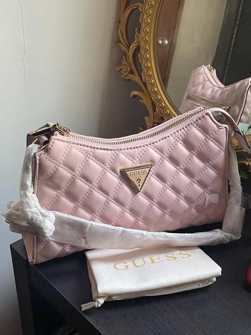 Guess Gully Quilted Shoulder Bag in Peony (Category: Shoulder Bags) located in Manila. Submitted by najiecart (Listing ID 1463325554, Image 1). Description: - Brand new pink Guess shoulder bag - Elegant quilted design - Chic gold hardware - Secure zipper closure - Interior Guess logo lining - Convenient interior zip pocket - Comes with original dust bag - Strap still has protective plastic on it.