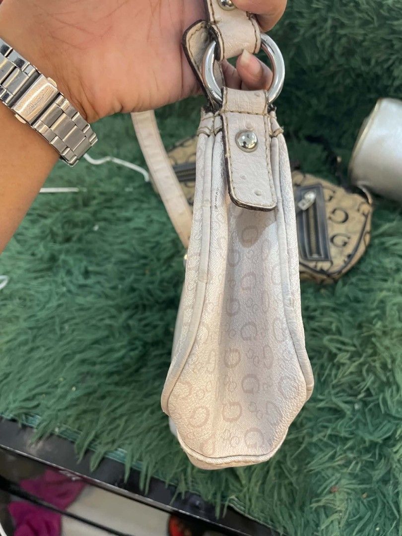 Guess Monogram Shoulder Bag (Category: Shoulder Bags) located in Cainta. Submitted by mariss.luxx (Listing ID 1463239242, Image 3). Description: - Cute Guess shoulder bag - Cream color with all-over G monogram pattern - Zipper closure - Includes a small strap - Ideal for everyday use - Please check photos for detailed condition.