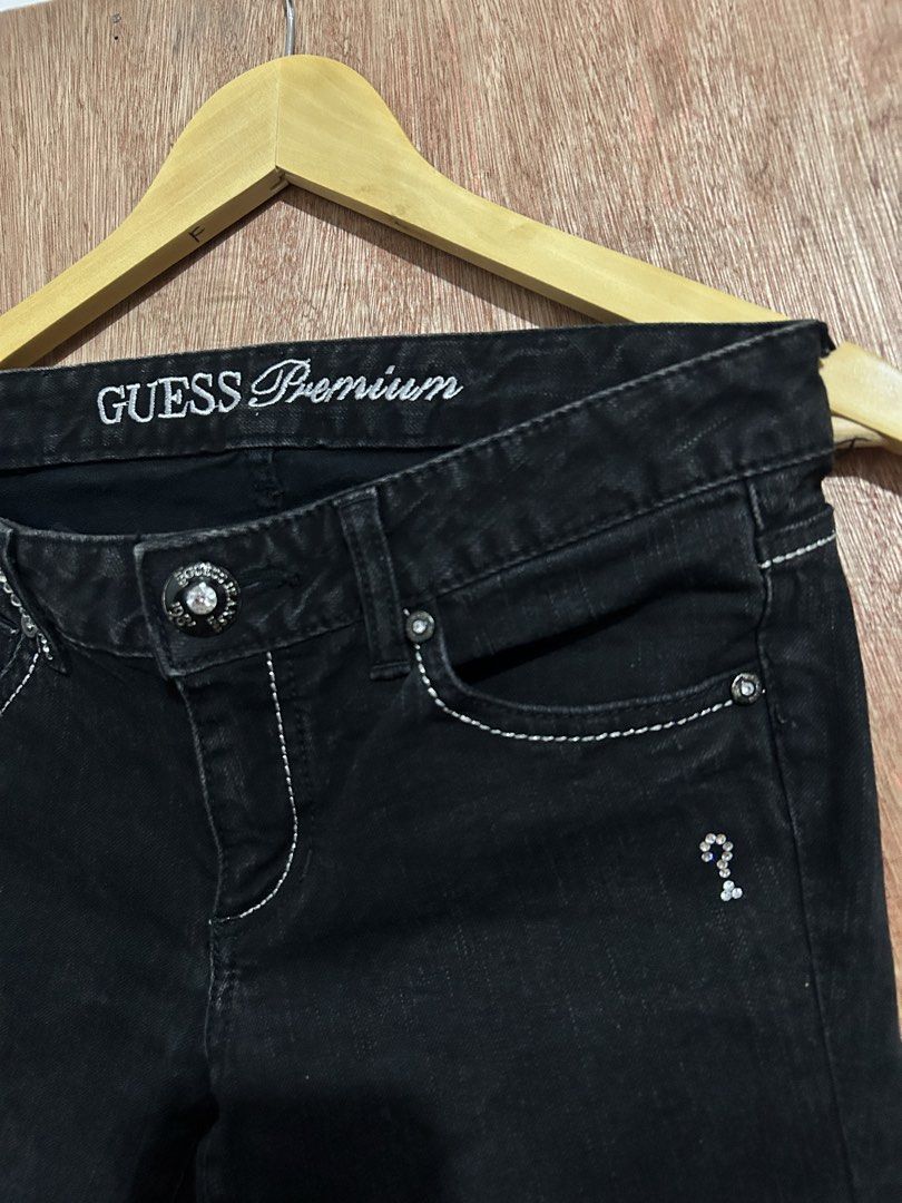 Guess Premium Black Jeans with Rhinestone Pockets (Category: Jeans) located in Davao. Submitted by orbetaarch23339 (Listing ID 1463310666, Image 3). Description: - Black Guess Premium jeans - White stitching detail throughout - Rhinestone-embellished back pockets with Guess logo - Button fly closure - Stylish denim.